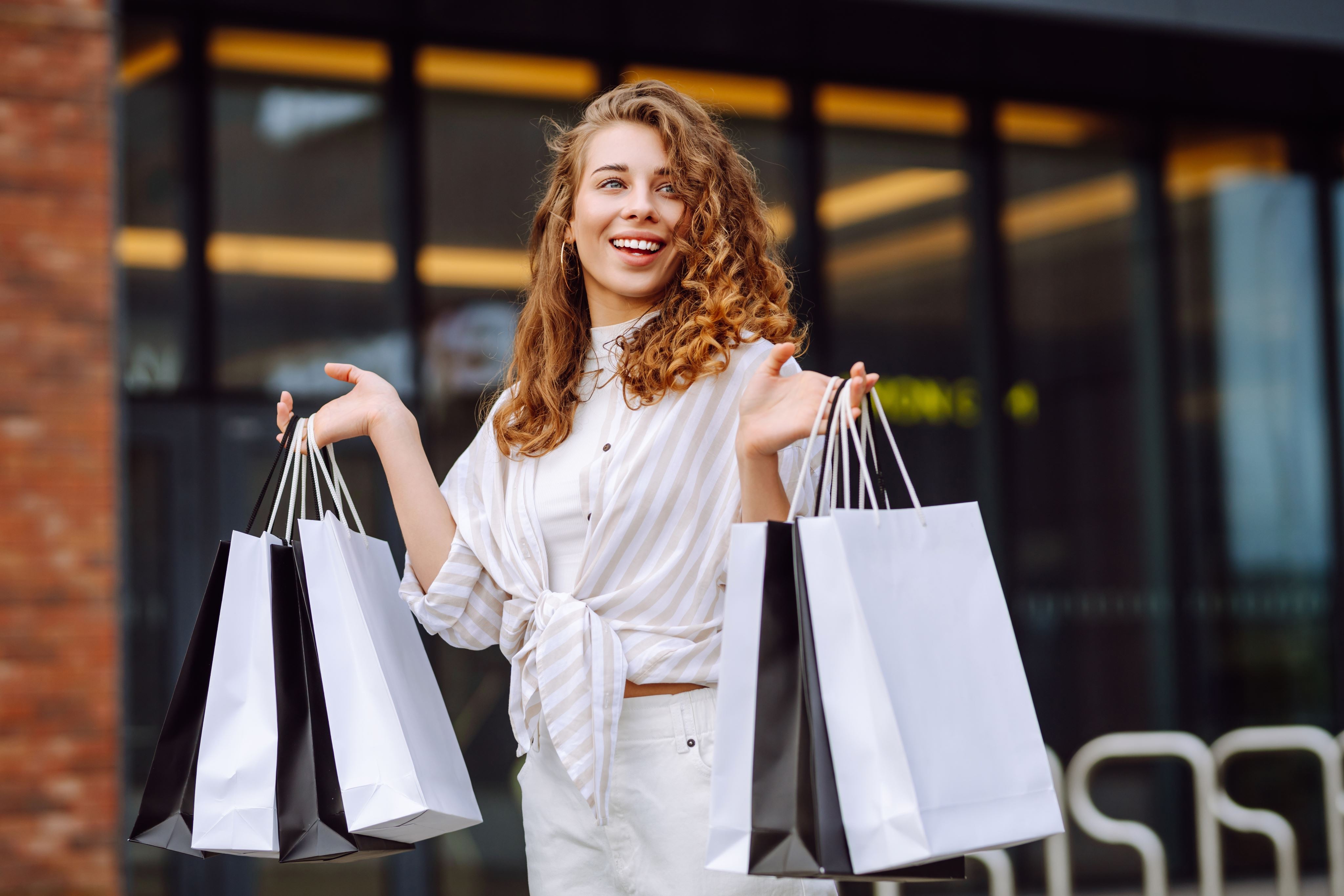 women holding shopping bags